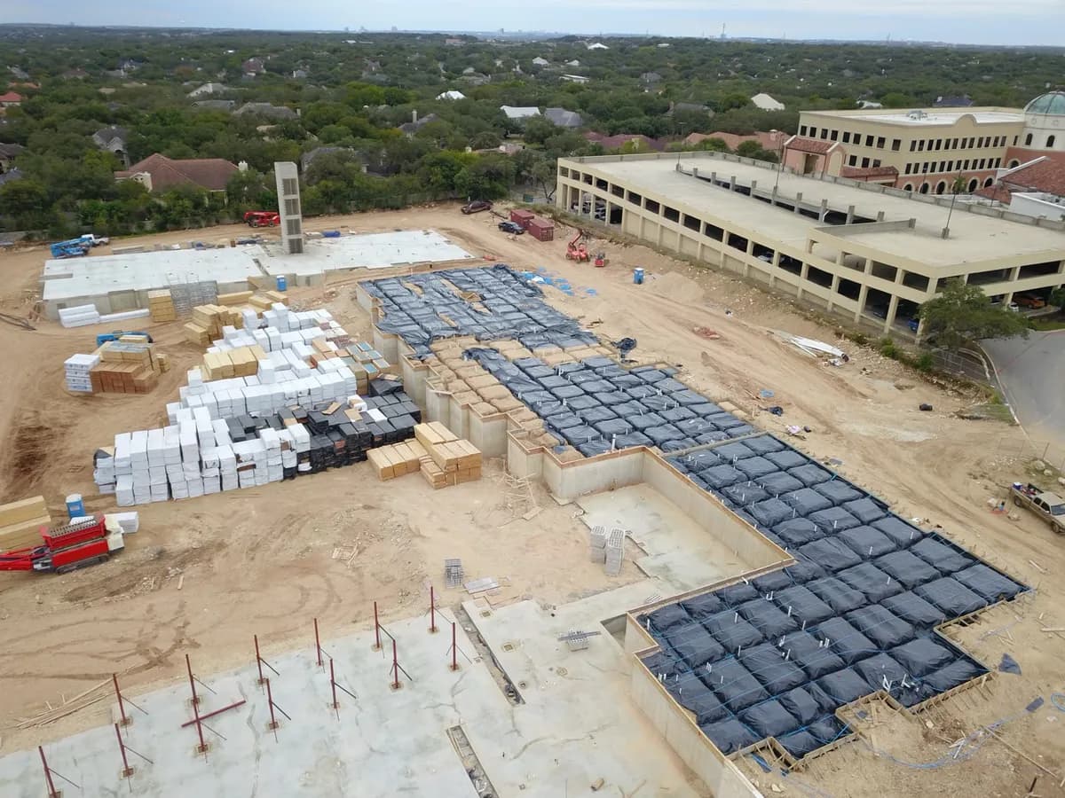 Aerial view of a large commercial concrete foundation pour in progress